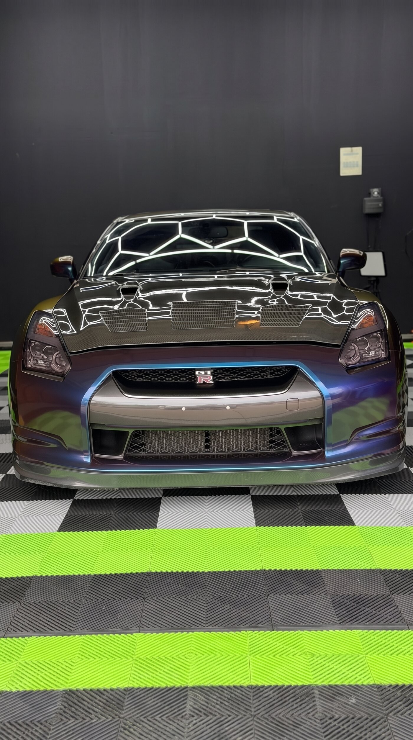 Finished Nissan GT-R in Avery Dennison Gloss Rushing Riptide, front three-quarter view